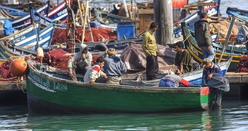 Fishermen in the harbour of Agadir makes for a great photo opportunity on all Morocco vacations.
