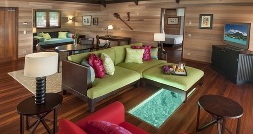 Lounge in the spacious rooms at the St. Regis Bora Bora during your Trip to Tahiti.