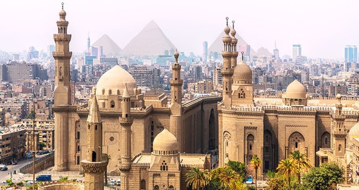 Explore the culture and architecture of Cairo with the iconic pyramids of GIza serving as the backdrop