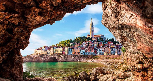 Stroll along the Adriatic Coast in Piran, a town known for its medieval appearance