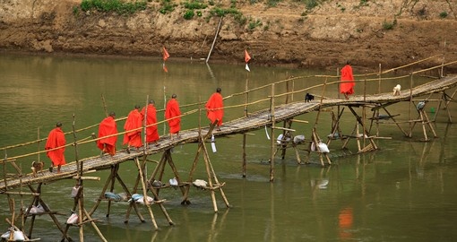 Crossing the river with a bamboo bridge