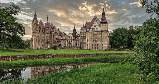 Stroll the romantic grounds of Moszna Castle, surrounded by acres of park