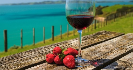 Glass of red wine with strawberries