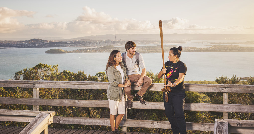 Tourist learning Maori traditions