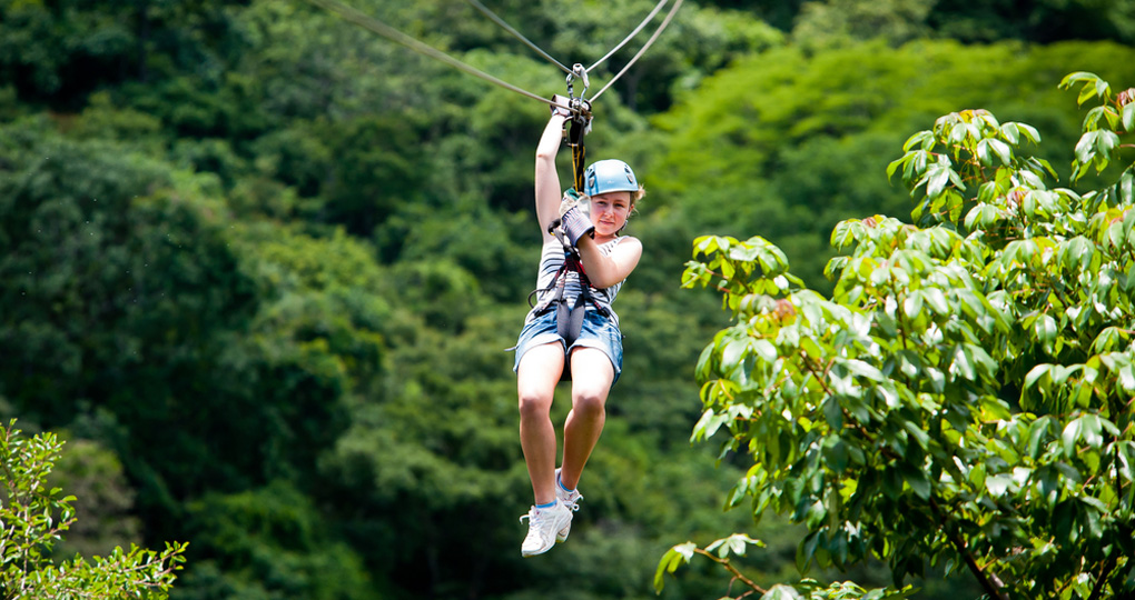 Person ziplining in the Costa Rica rainforest.