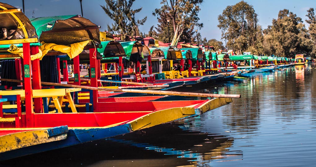 Traditional Mexican trajinera boats in Xochimilco channels 